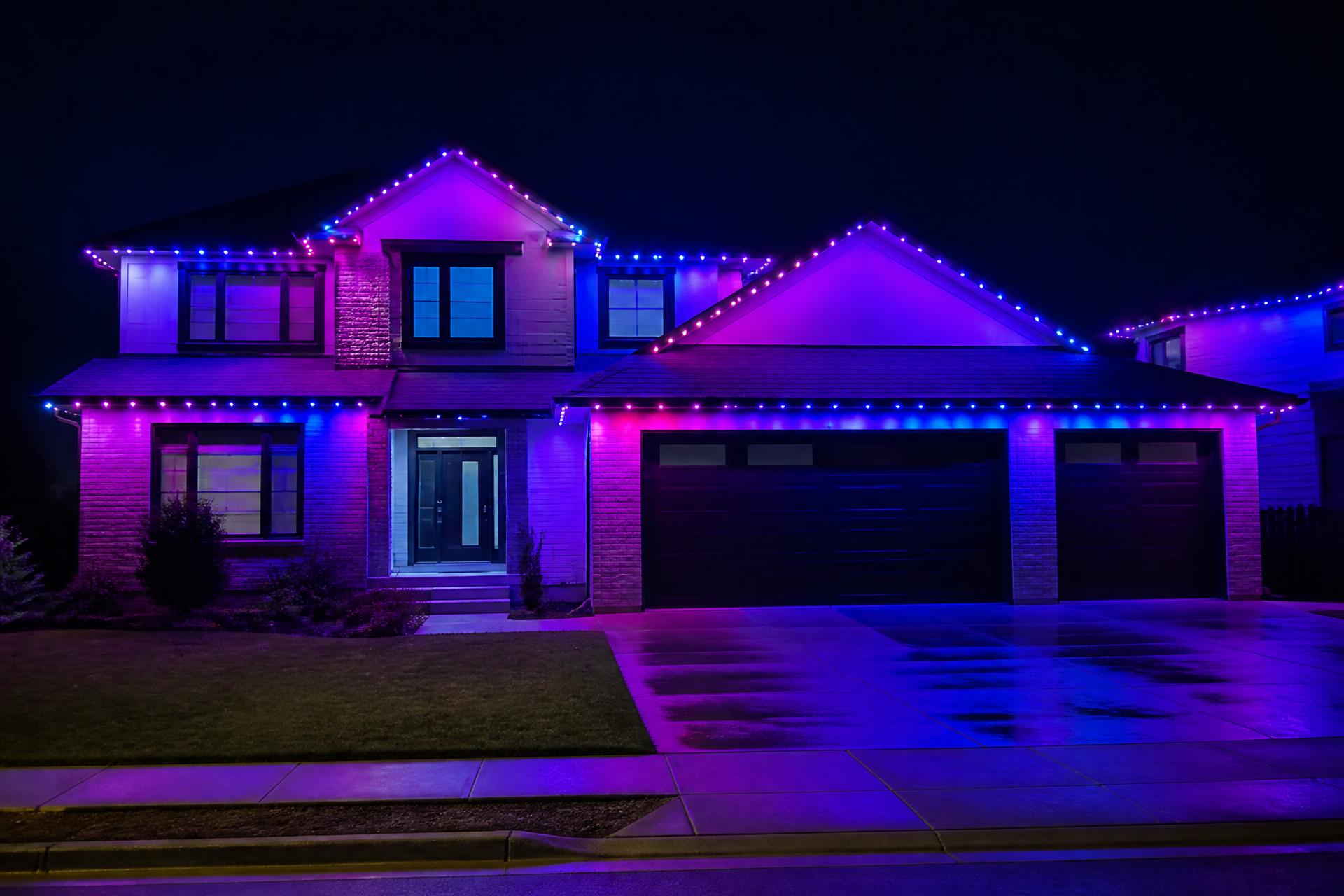 Modern luxury home at dusk with permanent exterior architectural lighting